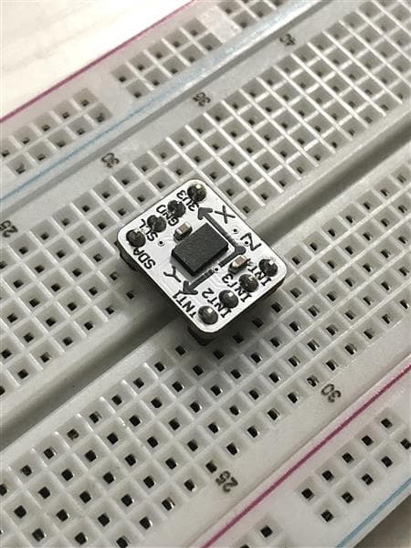 The assembled breakout seated in a breadboard, ready for I2C bring-up.