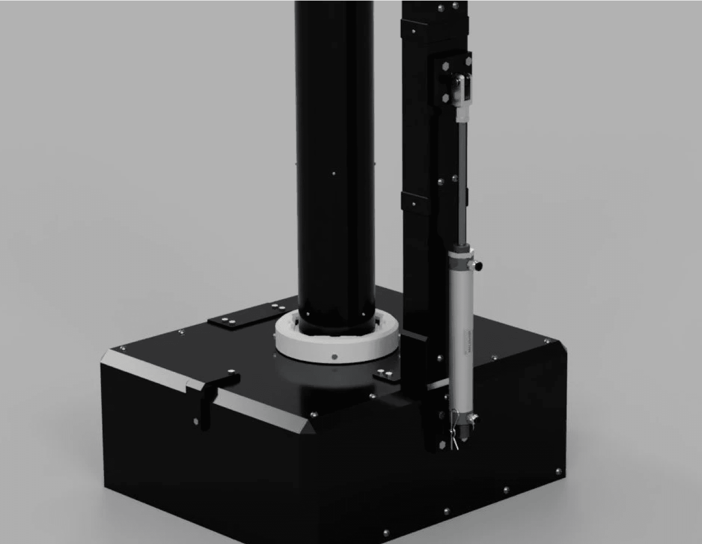 The pad base from behind: hydraulic actuator, white seating ring, and black enclosure.