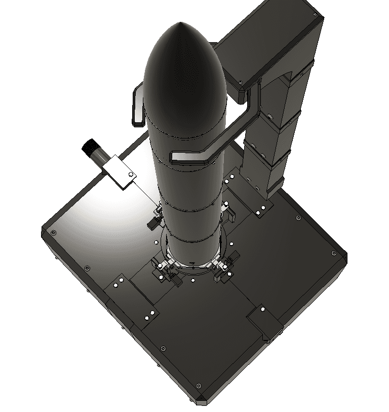 Top-down CAD of the pad: clamp arm, hold-downs, and the rocket seated in the ring.